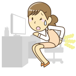 デスクワーク 腰を押さえる女性